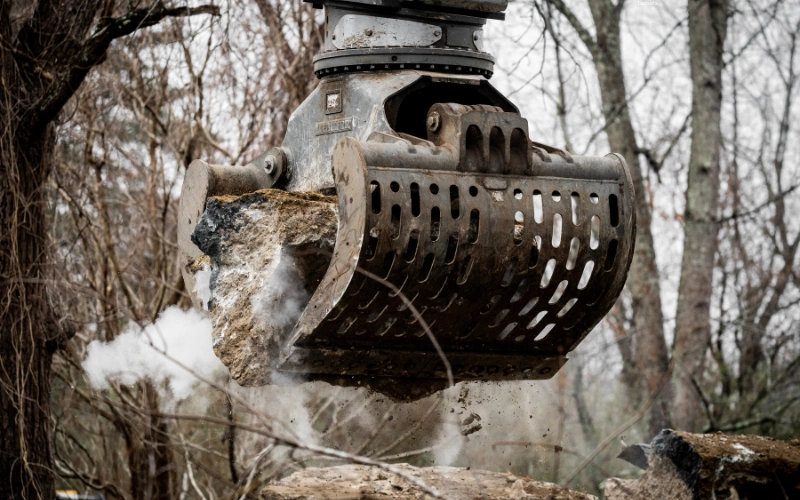 Image of backhoe attachments including buckets, augers, and hydraulic hammers, highlighting their diverse uses