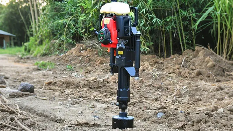 A handheld pile driver powered by gasoline