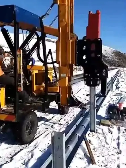 Everstar wheeled pile driver installs guardrail piles on a snowy road