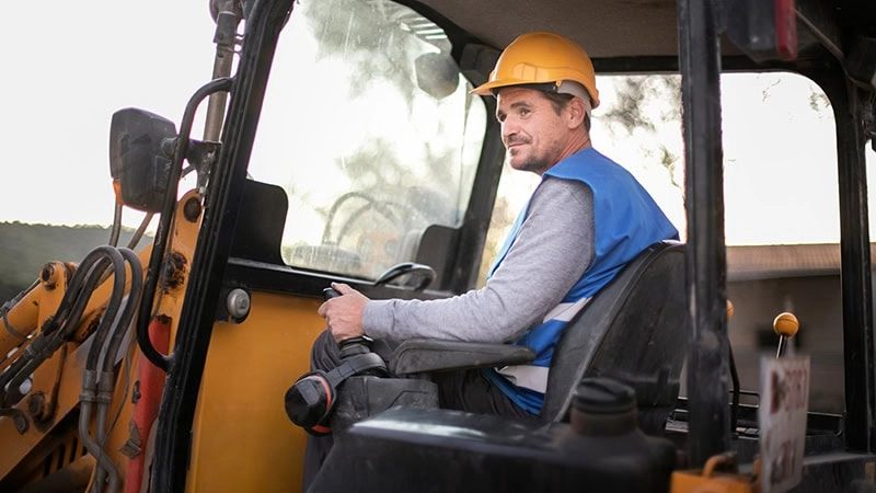 man using construction machine