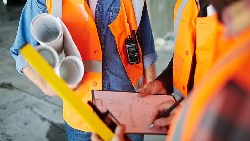 Construction workers view at document